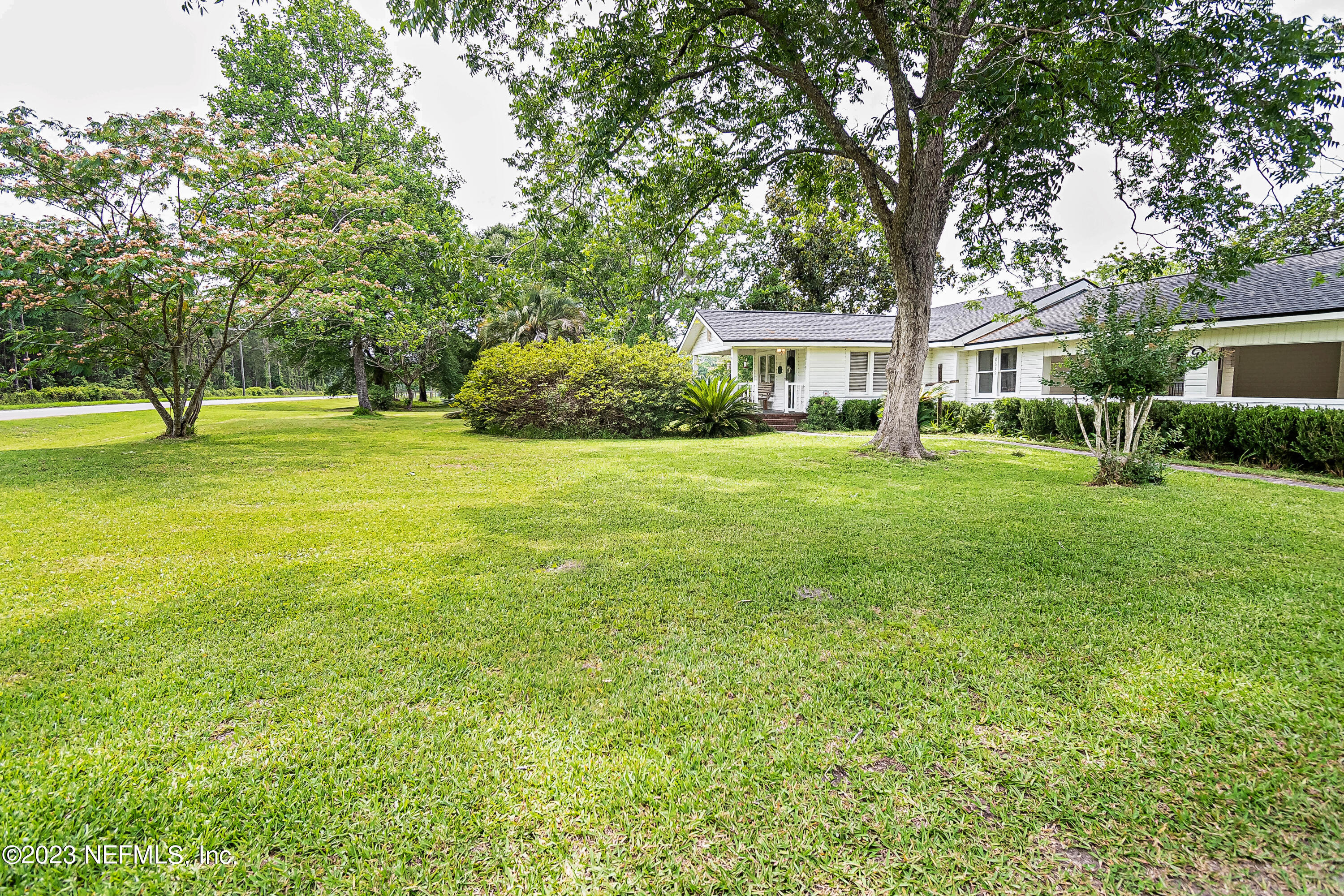 8619 Mud Lake Road Macclenny, FL 32063 - Photo 29 of 49 a view of a big yard with a house and large trees