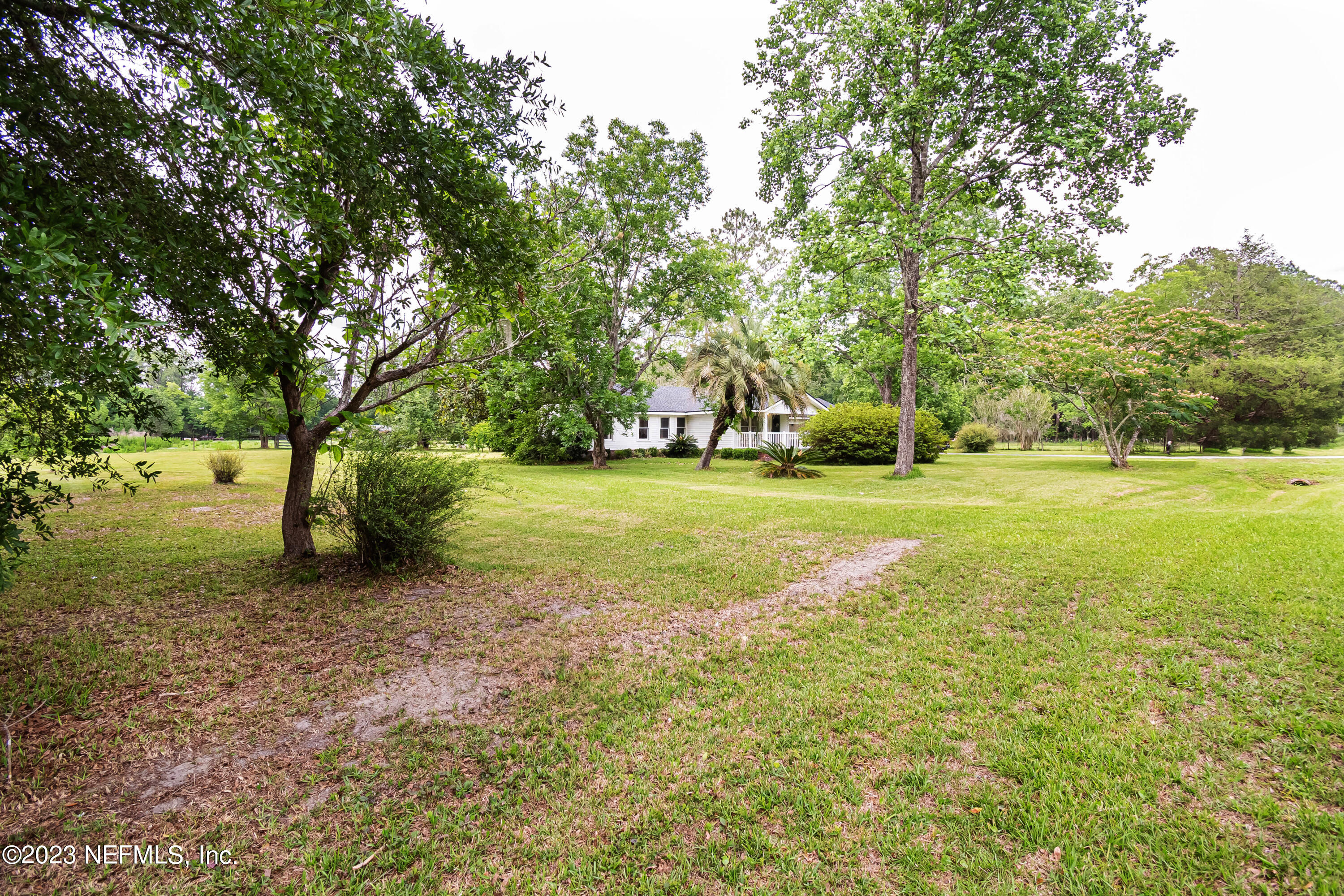8619 Mud Lake Road Macclenny, FL 32063 - Photo 32 of 49 a view of a field with trees in the background
