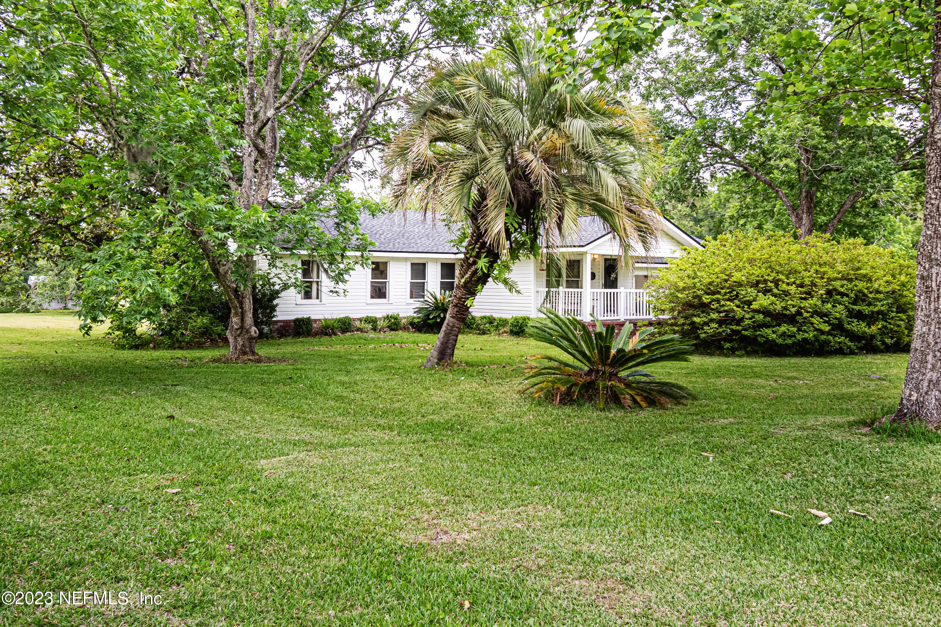 8619 Mud Lake Road Macclenny, FL 32063 - Photo 34 of 49 a view of a house with a backyard