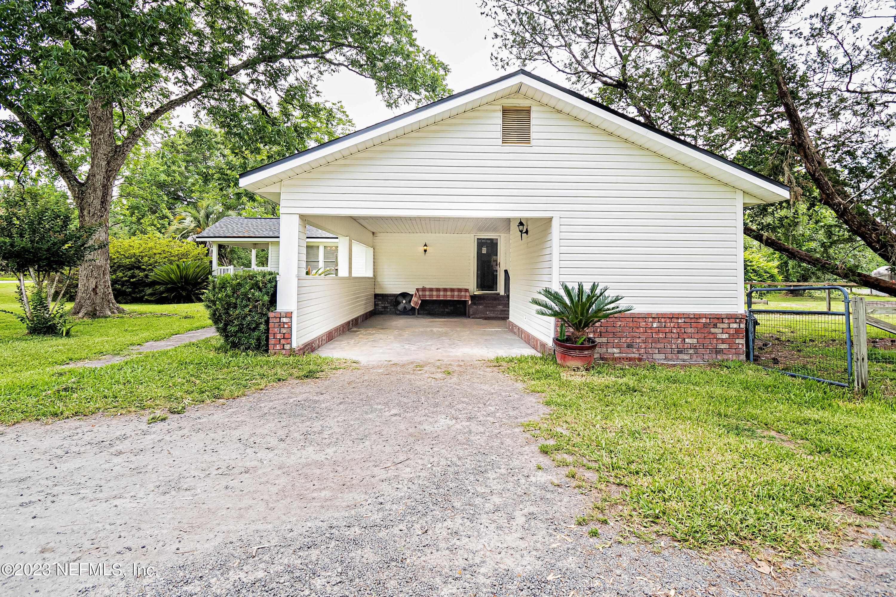 8619 Mud Lake Road Macclenny, FL 32063 - Photo 39 of 49 a view of a house with yard and a garden