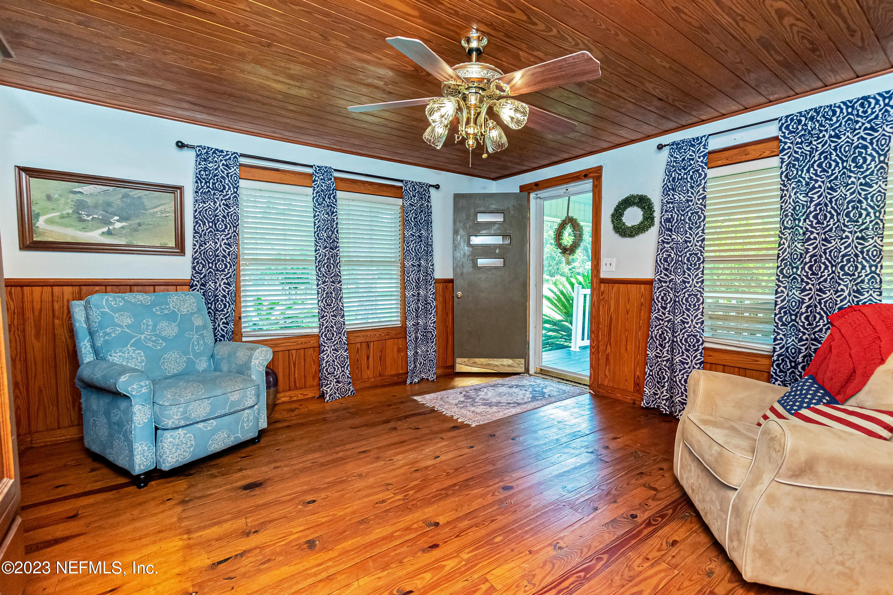 8619 Mud Lake Road Macclenny, FL 32063 - Photo 4 of 49 a living room with furniture and a chandelier