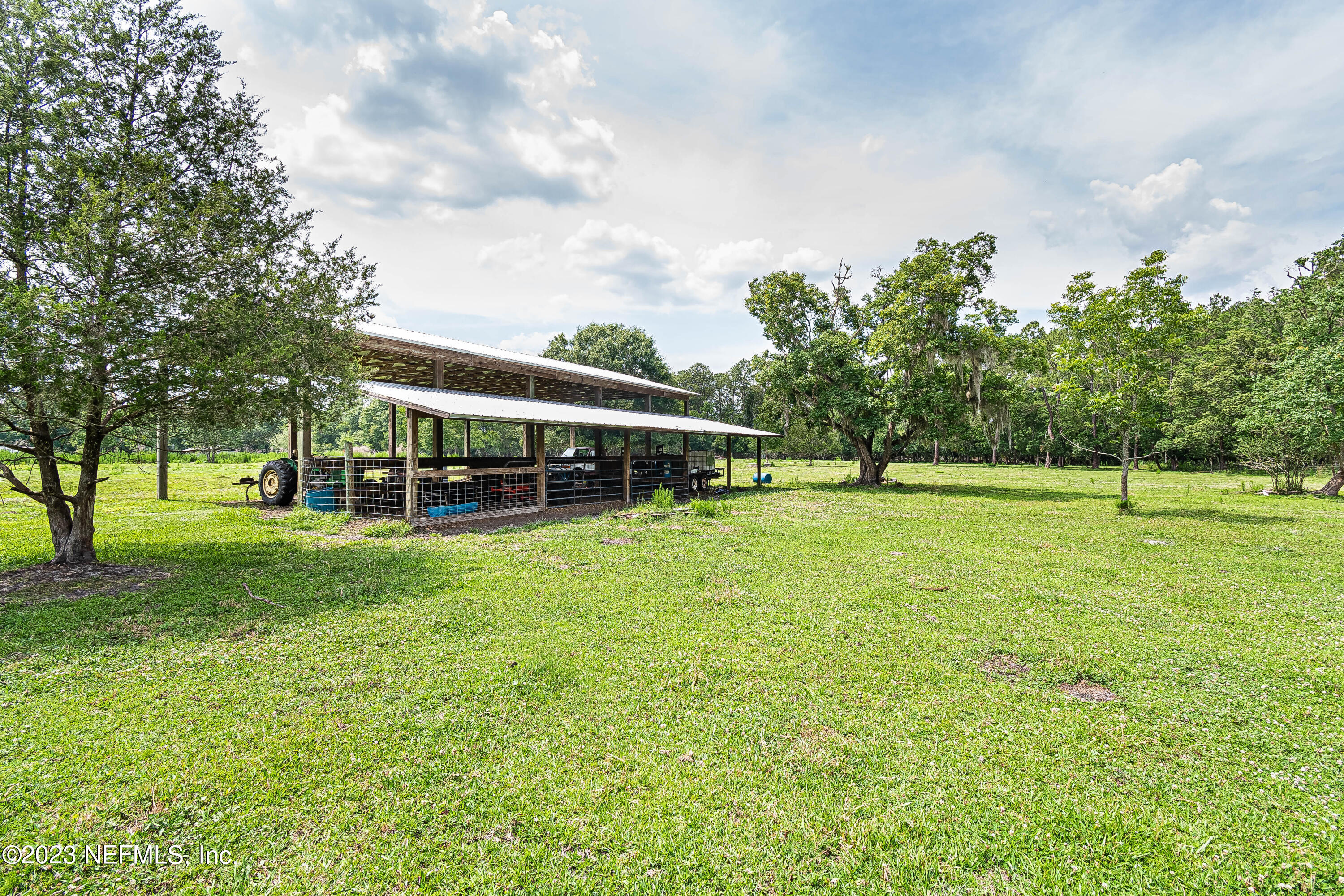 8619 Mud Lake Road Macclenny, FL 32063 - Photo 41 of 49 a view of house with a big yard