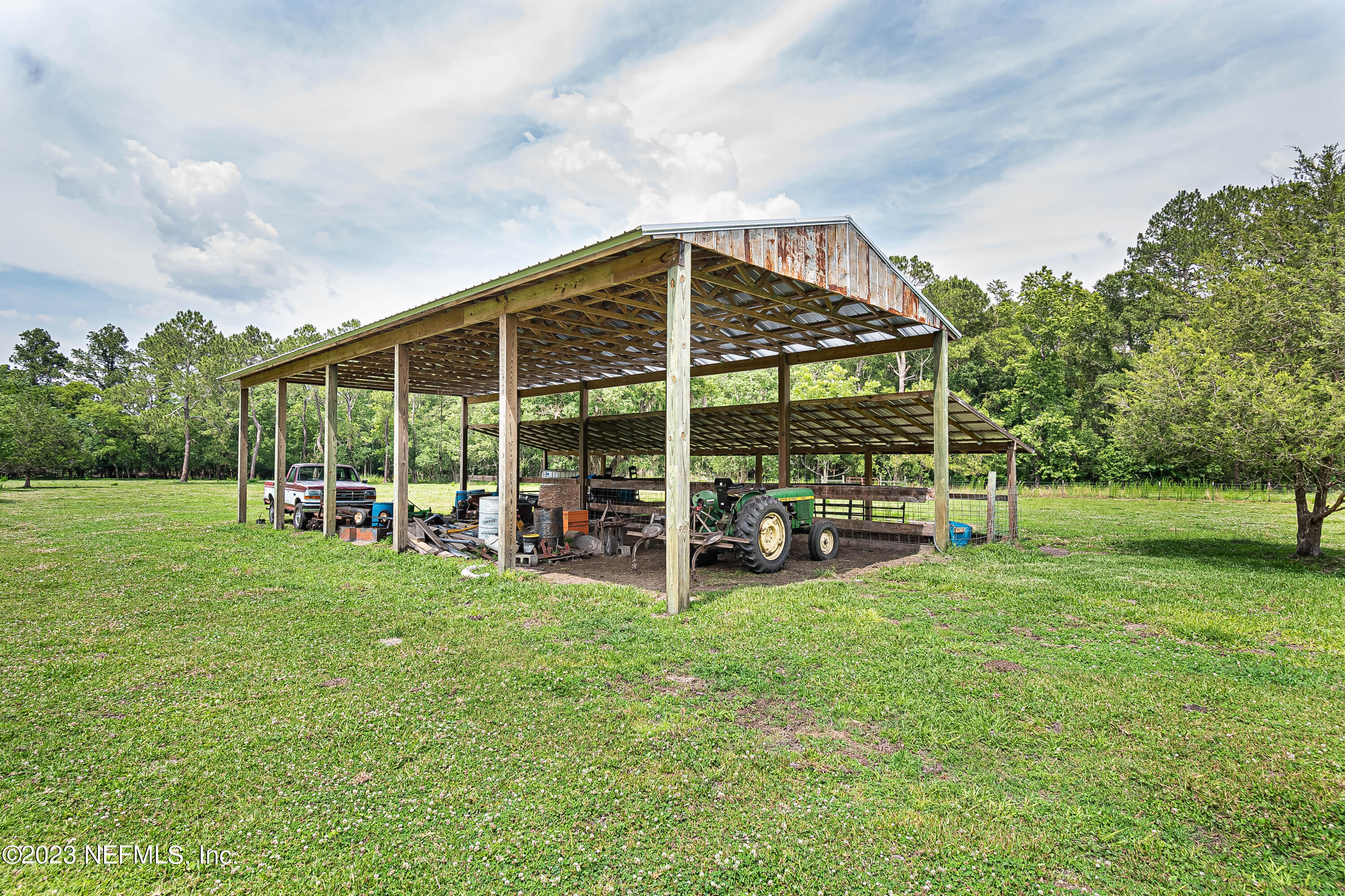 8619 Mud Lake Road Macclenny, FL 32063 - Photo 42 of 49 a view of a house with backyard and sitting area