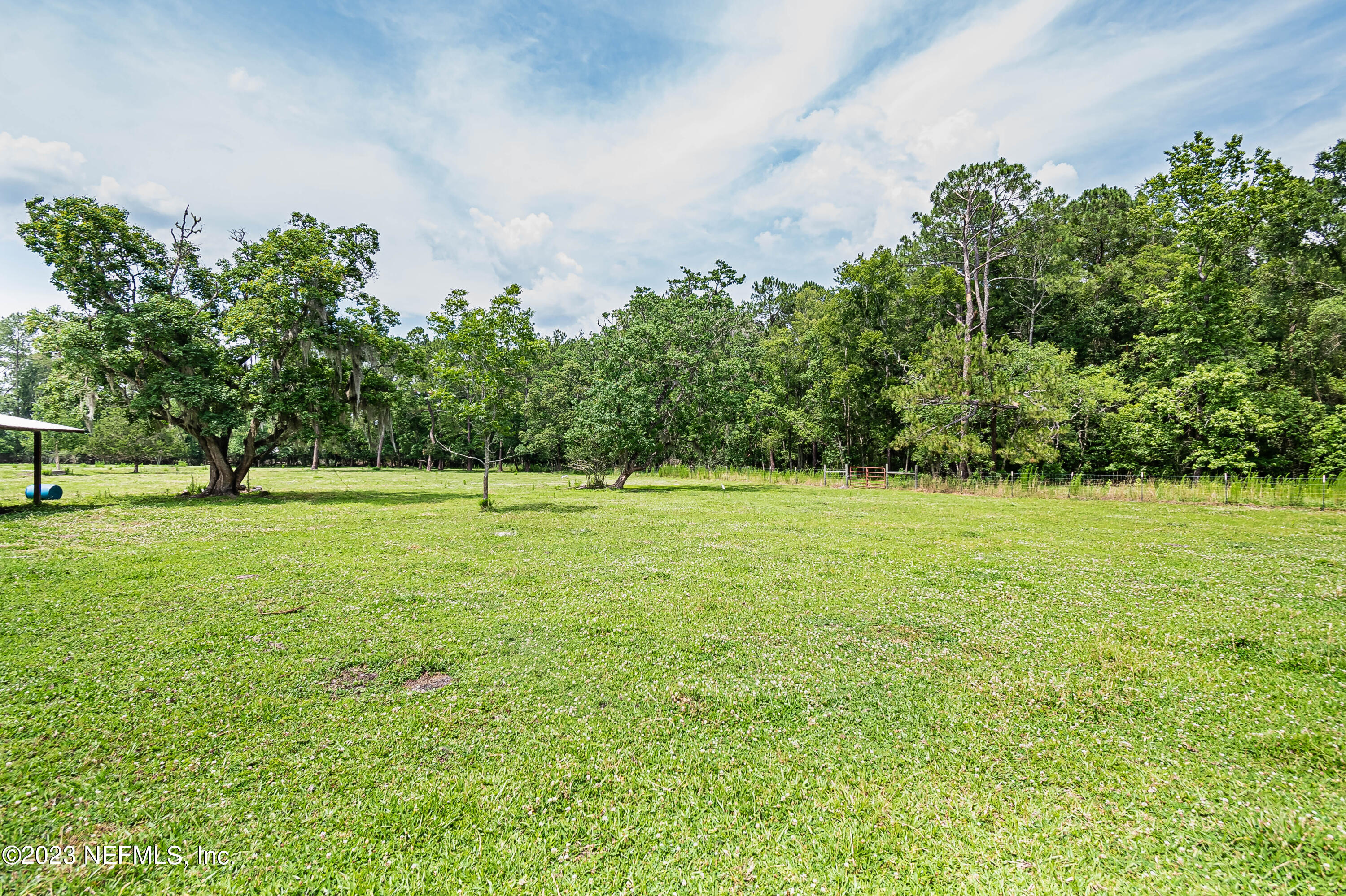 8619 Mud Lake Road Macclenny, FL 32063 - Photo 45 of 49 a view of outdoor space with deck and trees