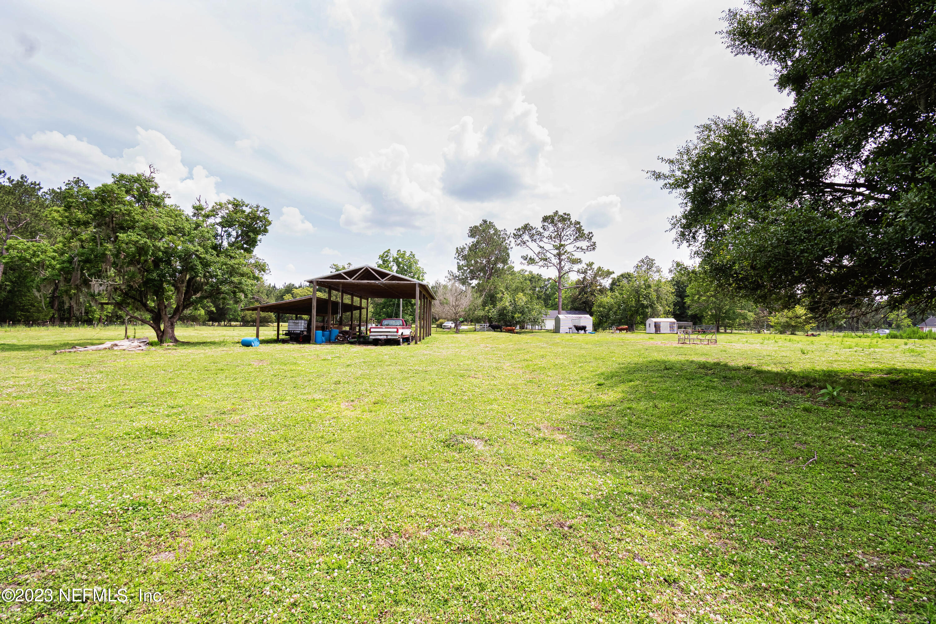 8619 Mud Lake Road Macclenny, FL 32063 - Photo 48 of 49 a yellow building with trees in the background