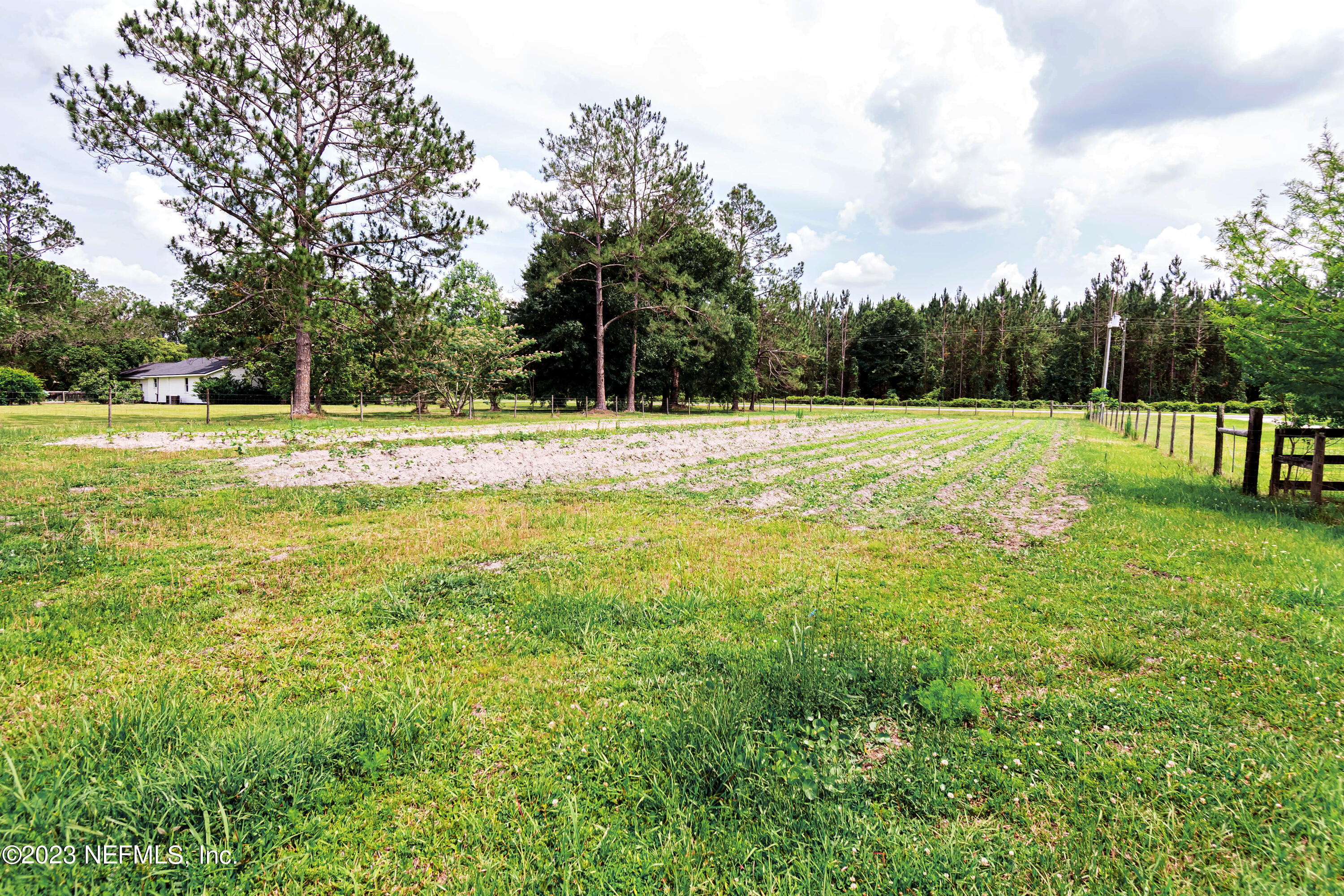 8619 Mud Lake Road Macclenny, FL 32063 - Photo 49 of 49 a view of a swimming pool with a yard