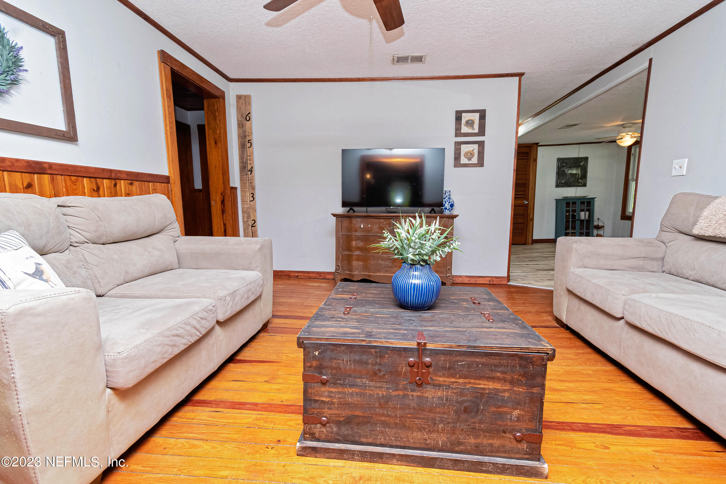 8619 Mud Lake Road Macclenny, FL 32063 - Photo 5 of 49 a living room with furniture and a flat screen tv