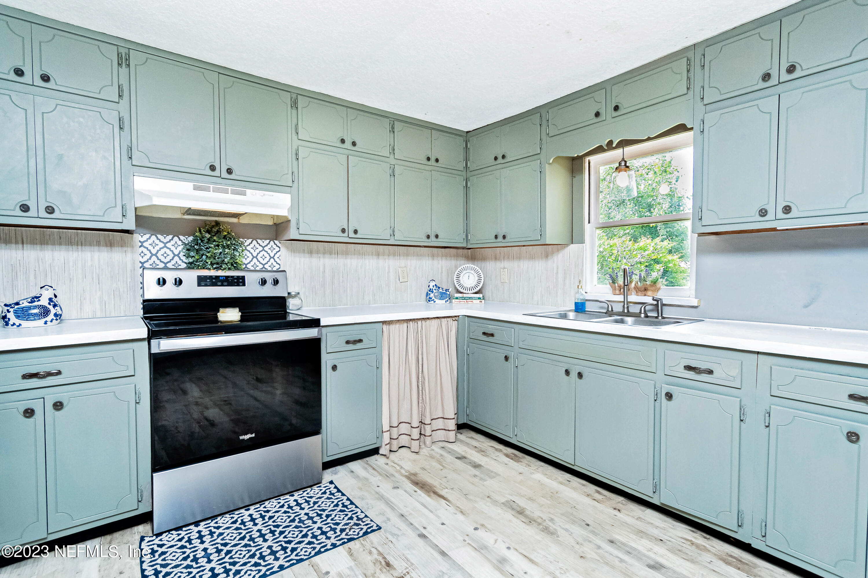 8619 Mud Lake Road Macclenny, FL 32063 - Photo 8 of 49 a kitchen with a sink cabinets and window