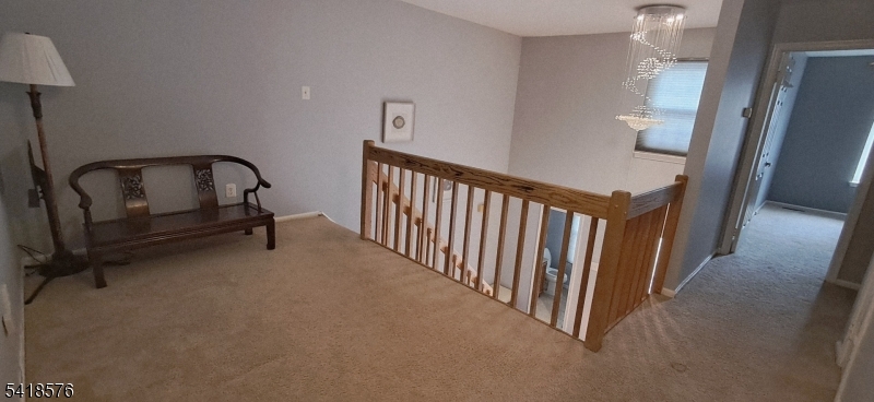 15 Andover Circle Princeton, NJ 08540 - Photo 11 of 16 a view of a hallway with wooden floor and staircase