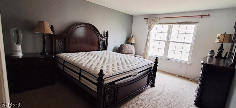 15 Andover Circle Princeton, NJ 08540 - Photo 12 of 16 a bed sitting in a bedroom next to a window
