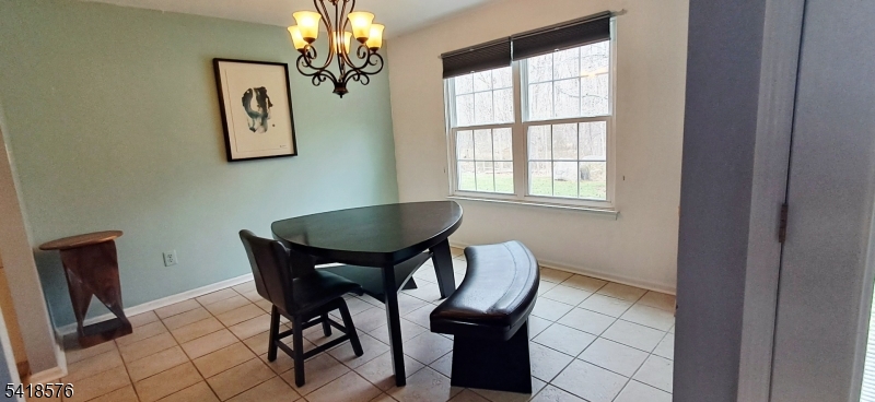 15 Andover Circle Princeton, NJ 08540 - Photo 9 of 16 a view of a dining room with furniture and a chandelier
