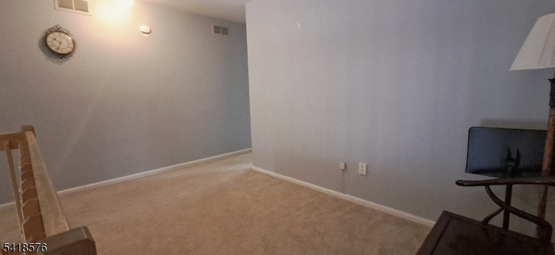 15 Andover Circle Princeton, NJ 08540 - Photo 10 of 16 a room with a window and wooden floor