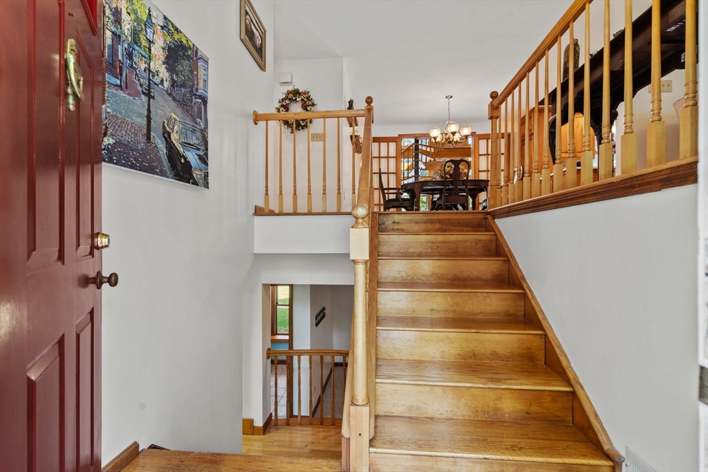 3 Summit Groton, MA 01450 - Photo 11 of 38 a view of a living room with balcony and furniture