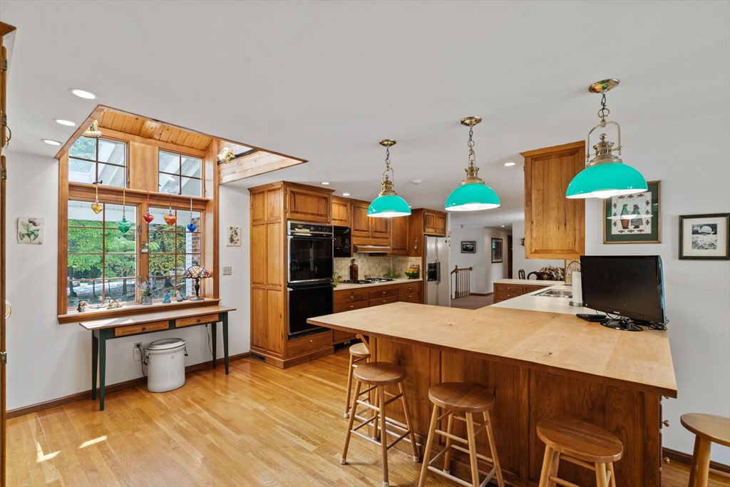 3 Summit Groton, MA 01450 - Photo 18 of 38 a view of a dining room with furniture window and wooden floor