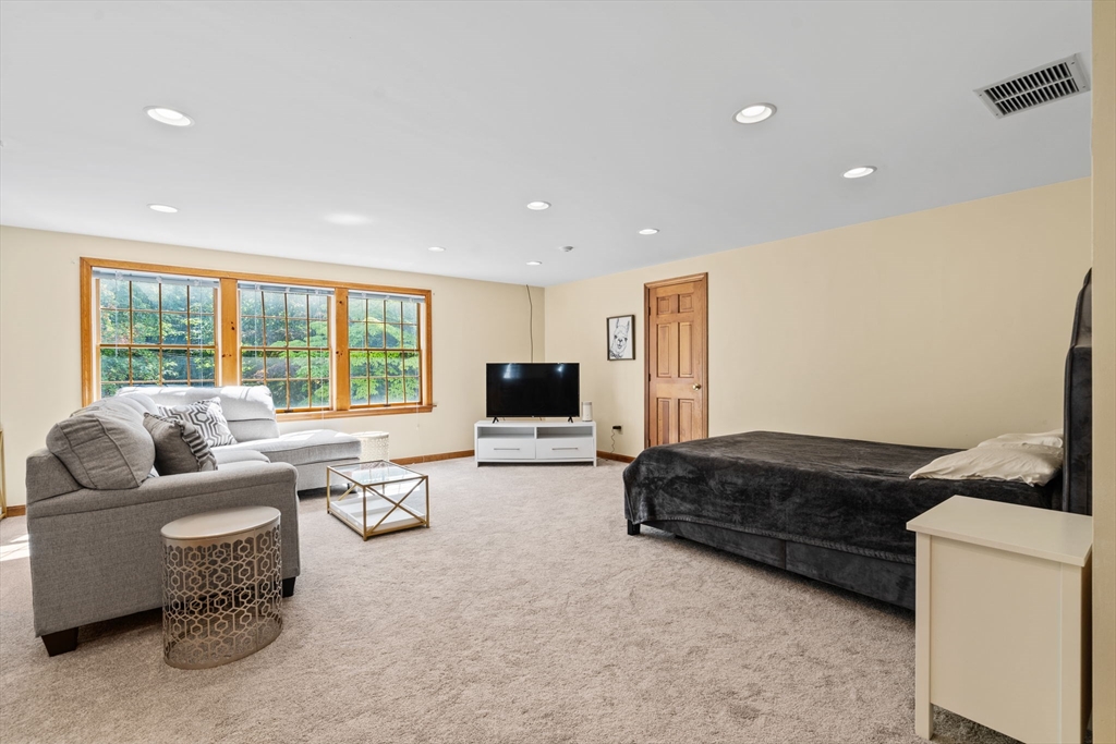 3 Summit Groton, MA 01450 - Photo 23 of 38 a living room with furniture and a flat screen tv