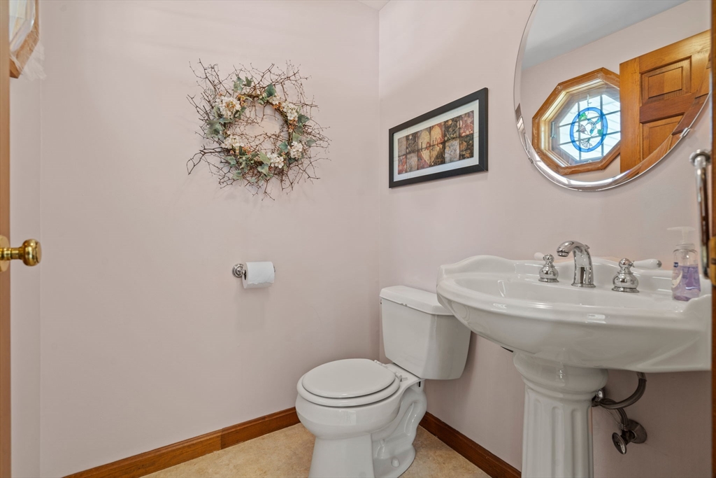 3 Summit Groton, MA 01450 - Photo 26 of 38 a bathroom with a toilet a sink and mirror