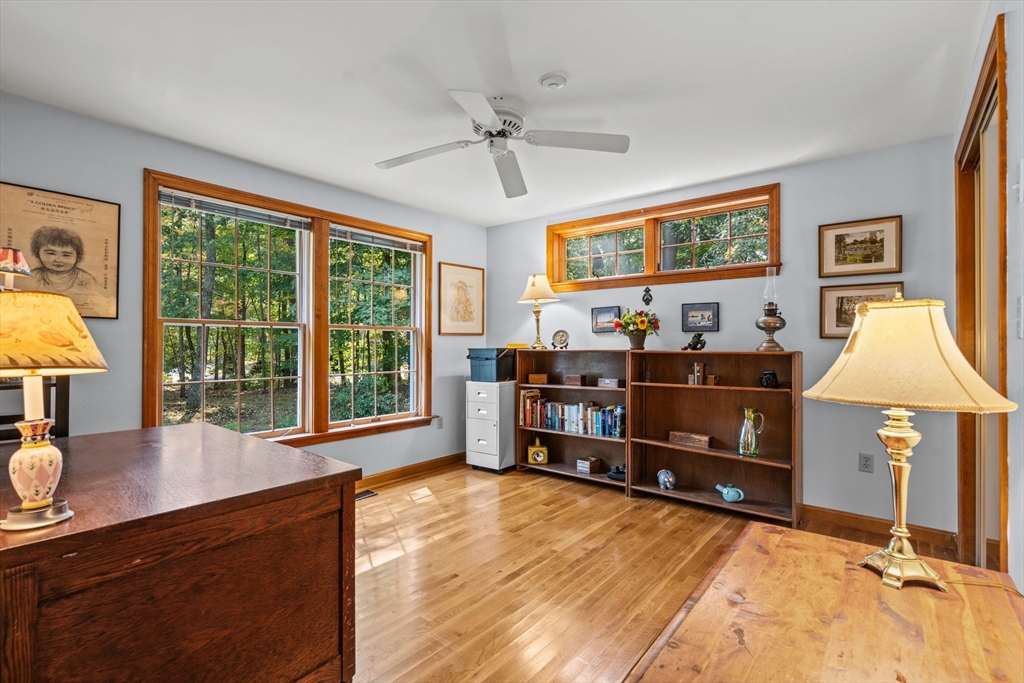 3 Summit Groton, MA 01450 - Photo 28 of 38 a living room with furniture and a flat screen tv
