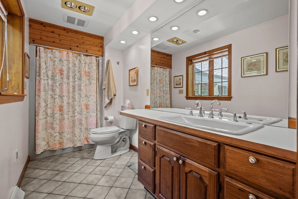 3 Summit Groton, MA 01450 - Photo 31 of 38 a spacious bathroom with a double vanity sink toilet mirror and shower