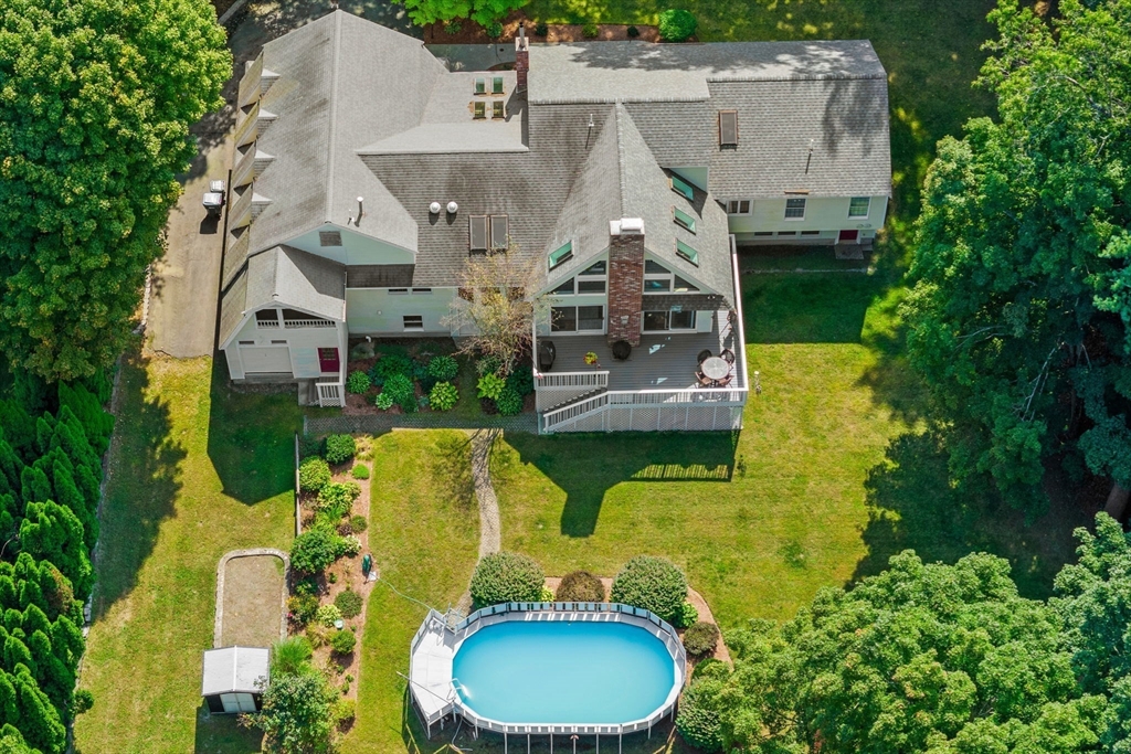 3 Summit Groton, MA 01450 - Photo 4 of 38 an aerial view of a house with swimming pool and large trees