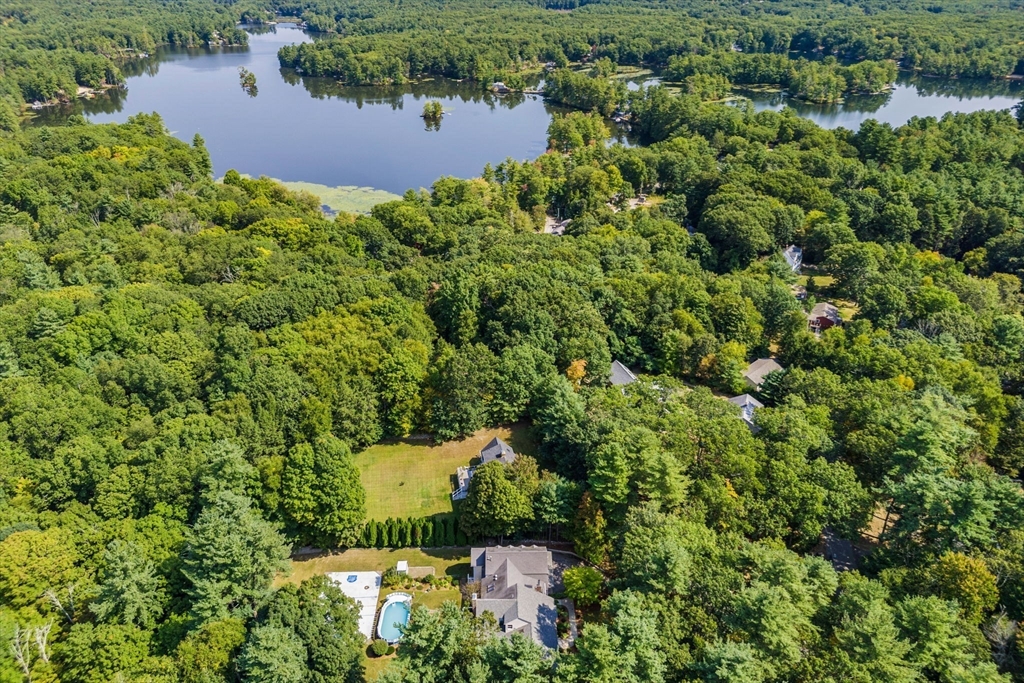 3 Summit Groton, MA 01450 - Photo 6 of 38 an aerial view of a house with a yard and lake view
