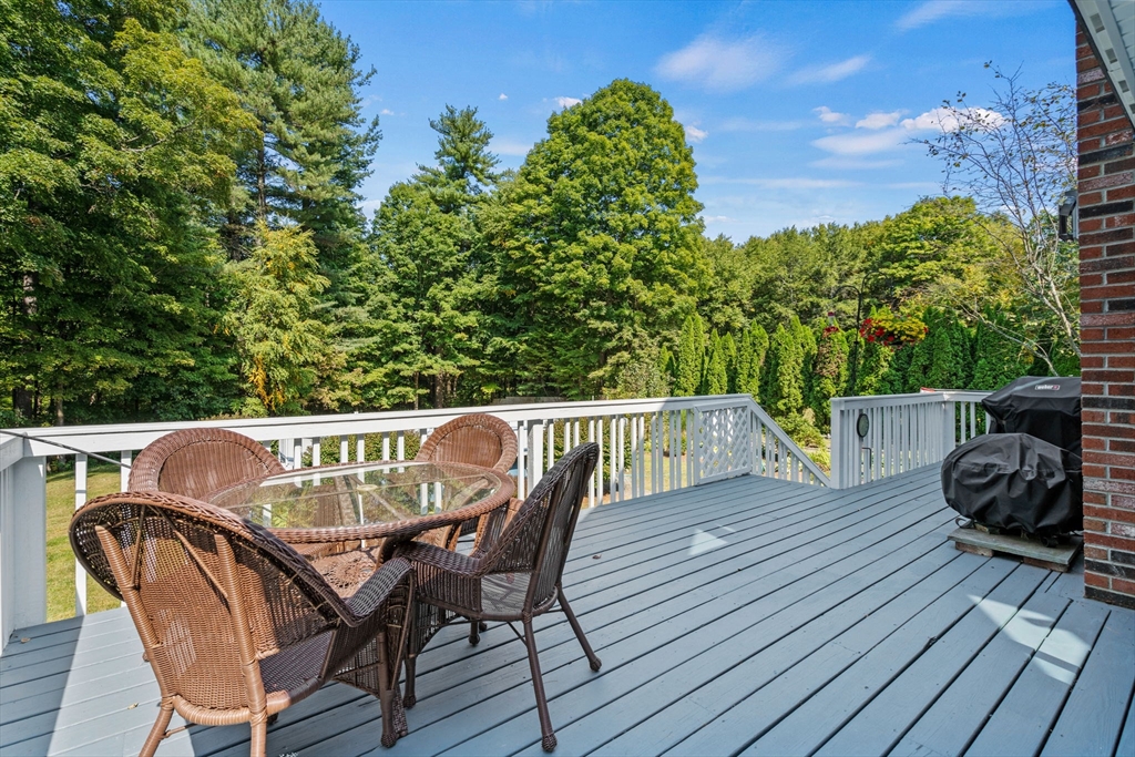 3 Summit Groton, MA 01450 - Photo 9 of 38 a view of balcony with wooden floor and outdoor seating