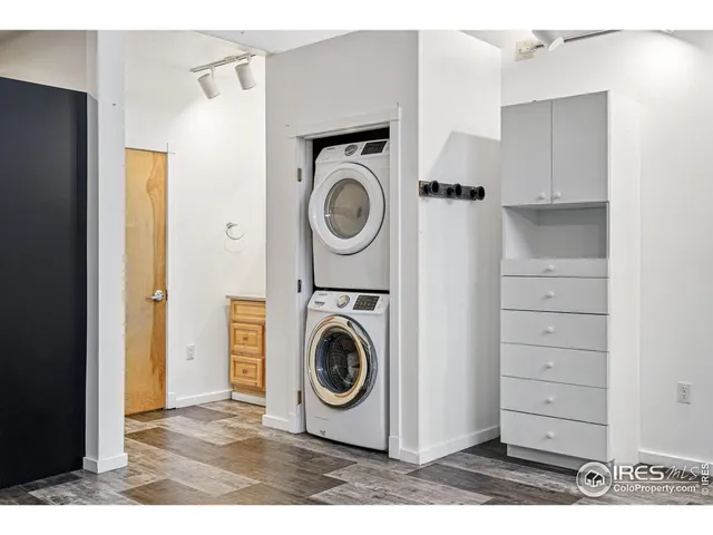 a utility room with sink dryer and washer