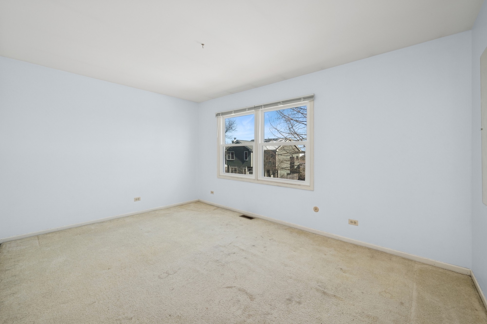 1005 Honeysuckle Drive Wheeling, IL 60090 - Photo 14 of 25 an empty room with windows