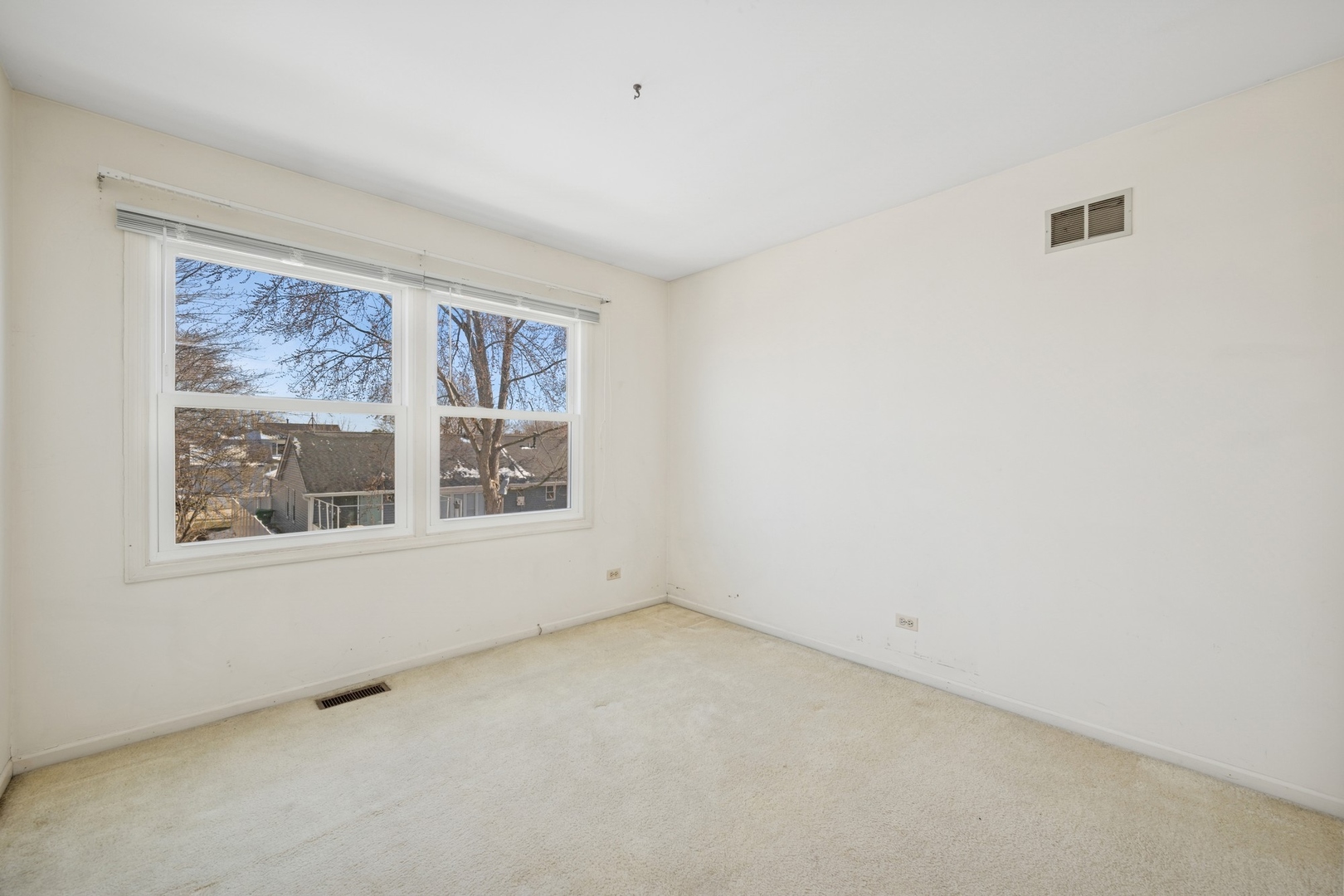 1005 Honeysuckle Drive Wheeling, IL 60090 - Photo 17 of 25 an empty room with a window
