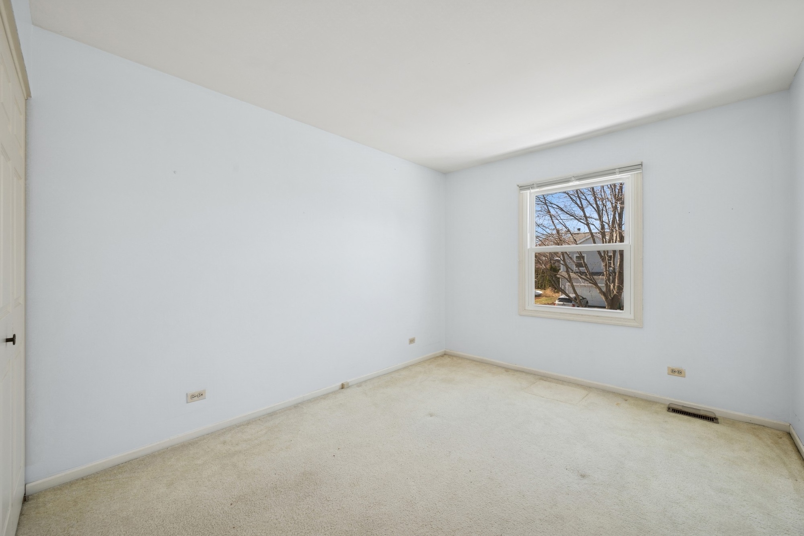 1005 Honeysuckle Drive Wheeling, IL 60090 - Photo 18 of 25 an empty room with a window
