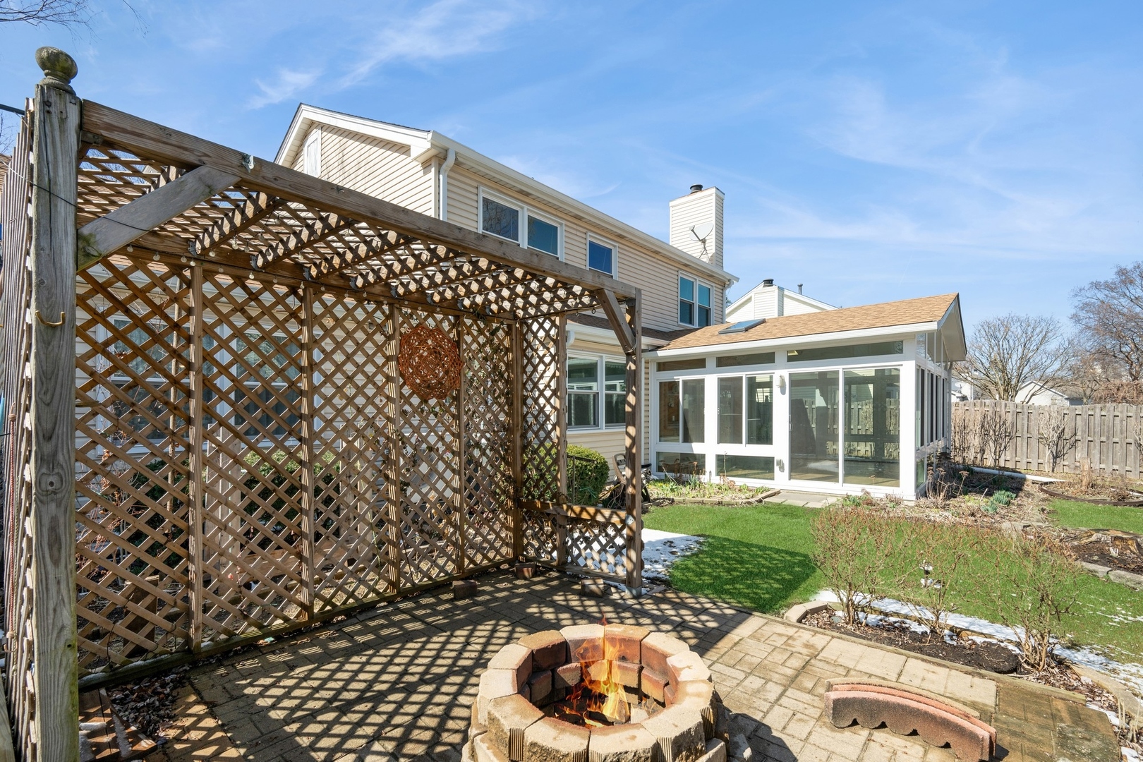 1005 Honeysuckle Drive Wheeling, IL 60090 - Photo 20 of 25 a front view of a house with a yard