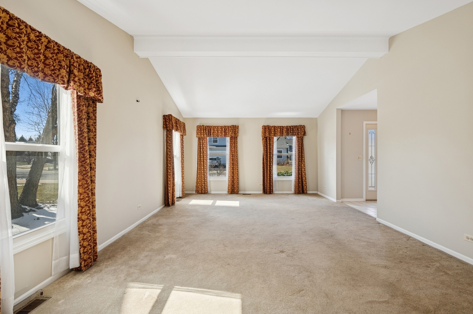 1005 Honeysuckle Drive Wheeling, IL 60090 - Photo 3 of 25 a view of an empty room with window and a kitchen