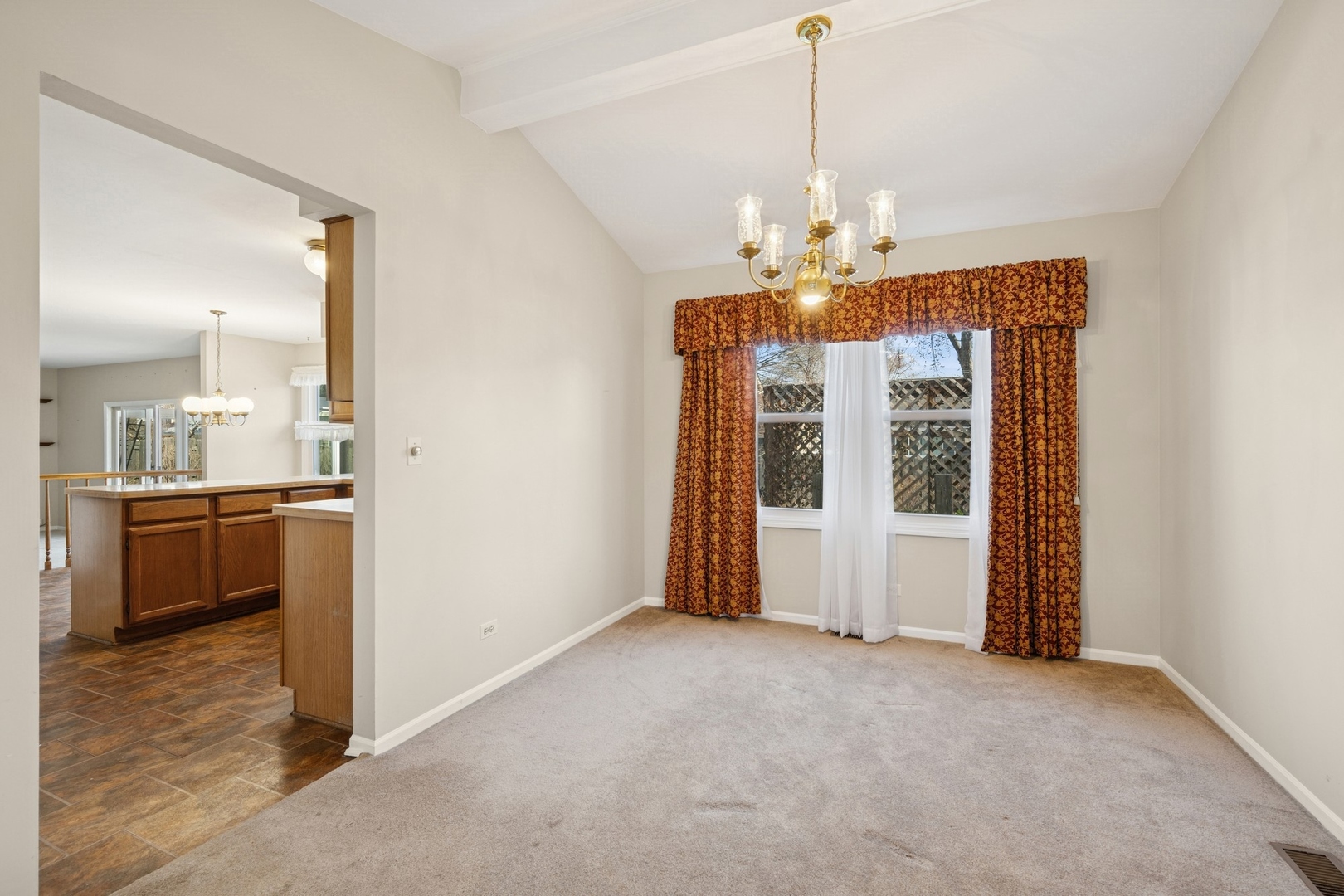 1005 Honeysuckle Drive Wheeling, IL 60090 - Photo 4 of 25 a view of a kitchen with a sink and refrigerator