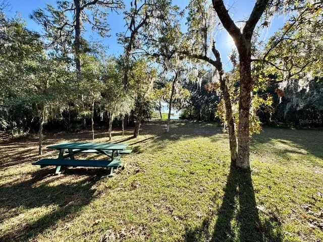 a view of a yard with an outdoor seating