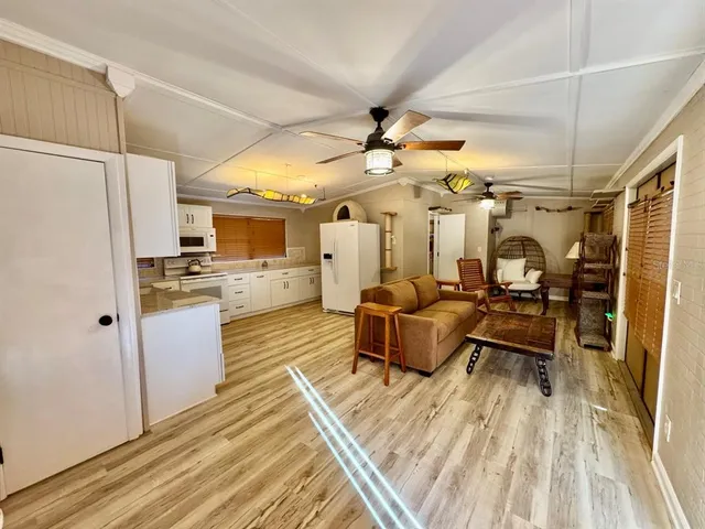 a large room with a lot of white furniture