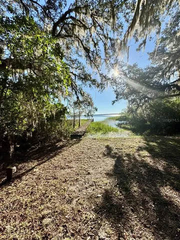 a view of a lake from a balcony with outdoor space