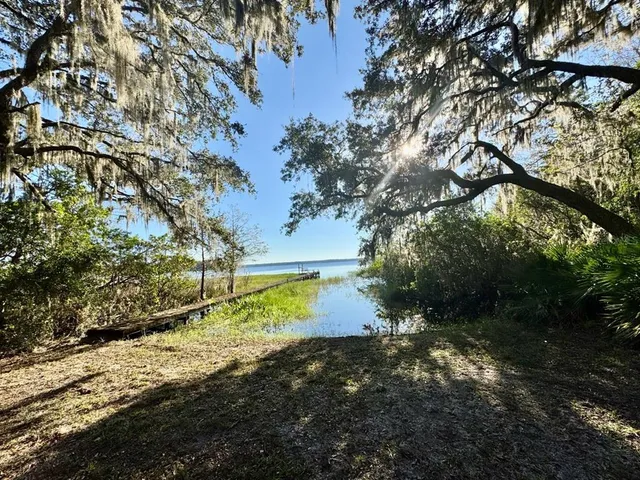 a view of a balcony with floor to ceiling windows