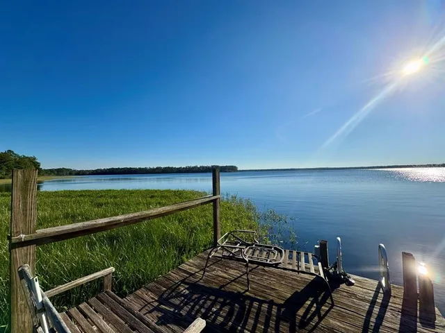 a view of lake with green space