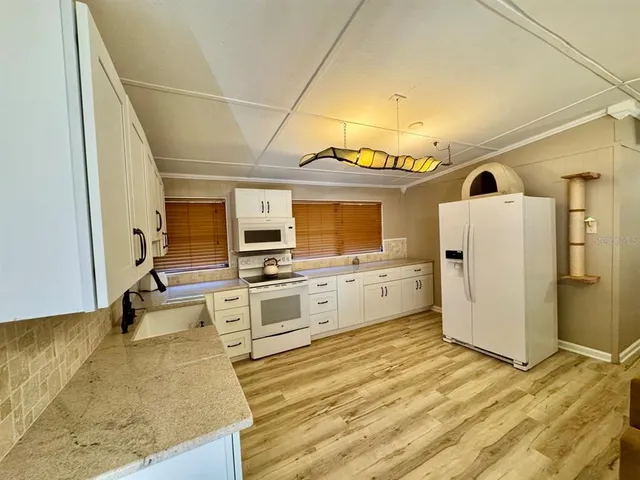a view of a kitchen with a sink