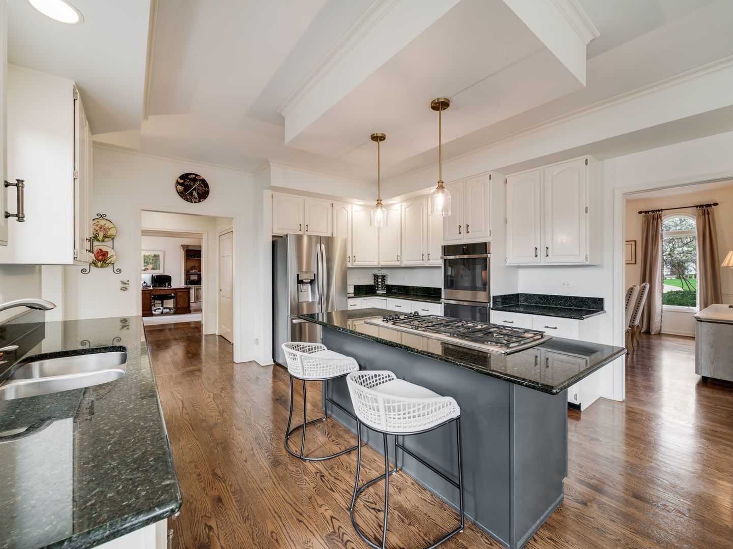 626 Buena Road Lake Forest, IL 60045 - Photo 13 of 37 a kitchen with a stove a refrigerator a oven a sink and white cabinets with wooden floor