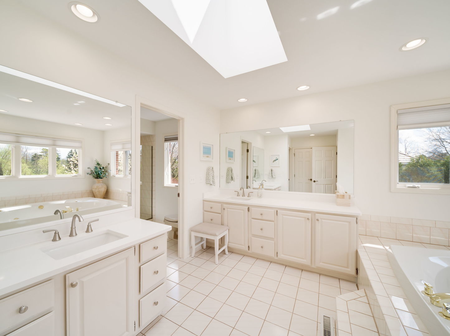 626 Buena Road Lake Forest, IL 60045 - Photo 17 of 37 a large bathroom with a double vanity sink a mirror and a bathtub