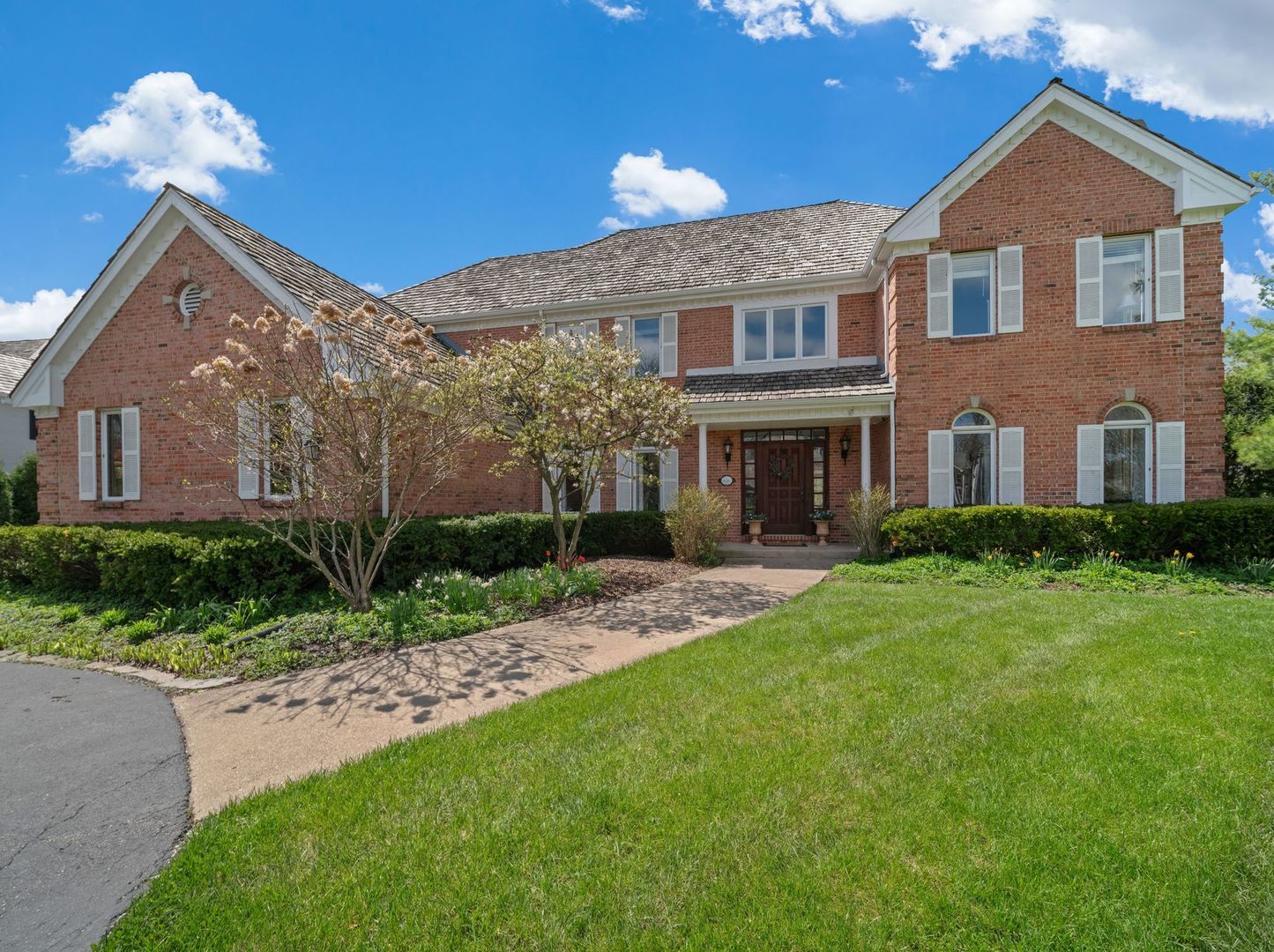 626 Buena Road Lake Forest, IL 60045 - Photo 2 of 37 a front view of a house with a yard