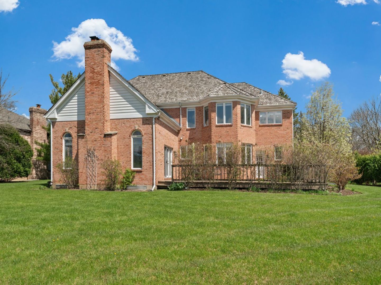 626 Buena Road Lake Forest, IL 60045 - Photo 36 of 37 a front view of a house with a garden and plants