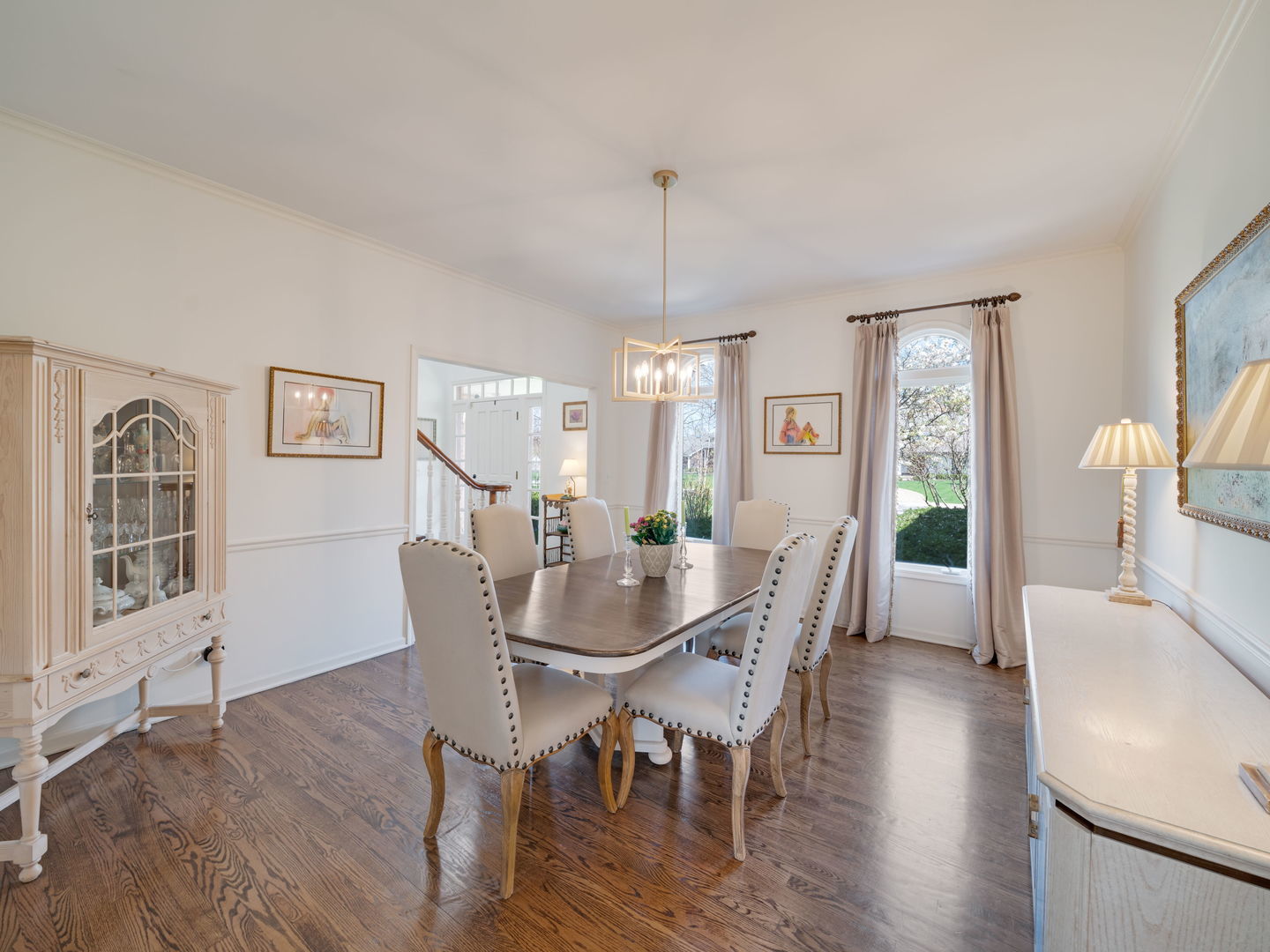 626 Buena Road Lake Forest, IL 60045 - Photo 7 of 37 a dining room with furniture a chandelier and wooden floor