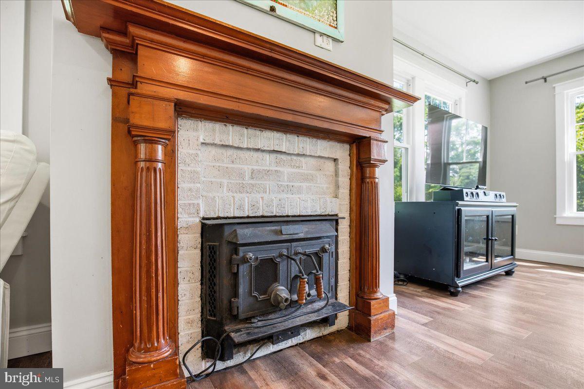 16146 Thomas Road Piney Point, MD 20674 - Photo 32 of 70 a living room with furniture and a fireplace