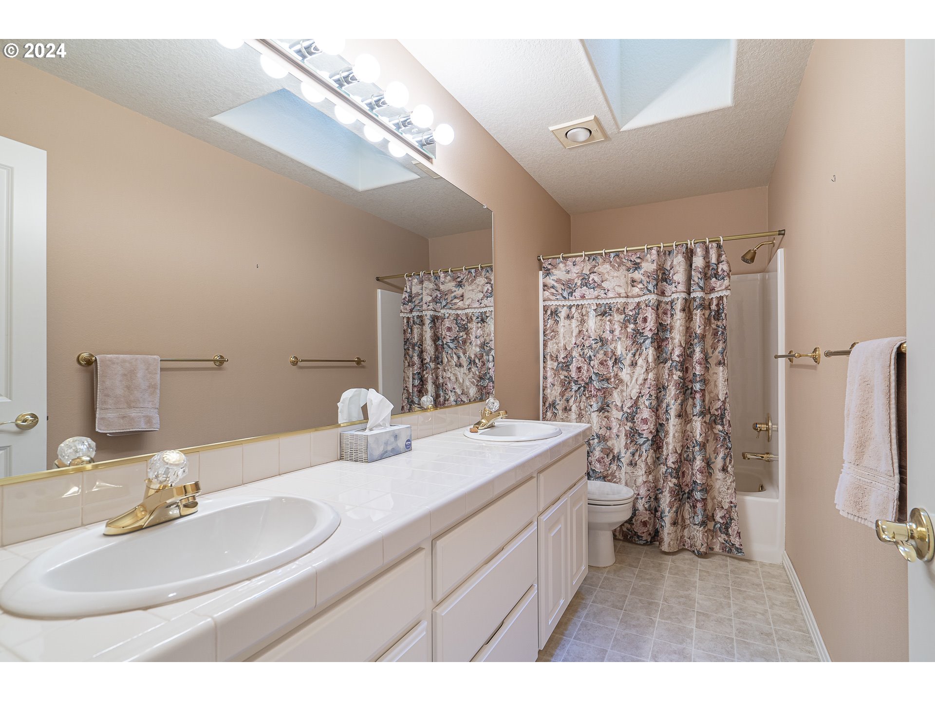 11084 Southeast Valley Way Happy Valley, OR 97086 - Photo 20 of 40 a bathroom with a double vanity sink mirror and shower