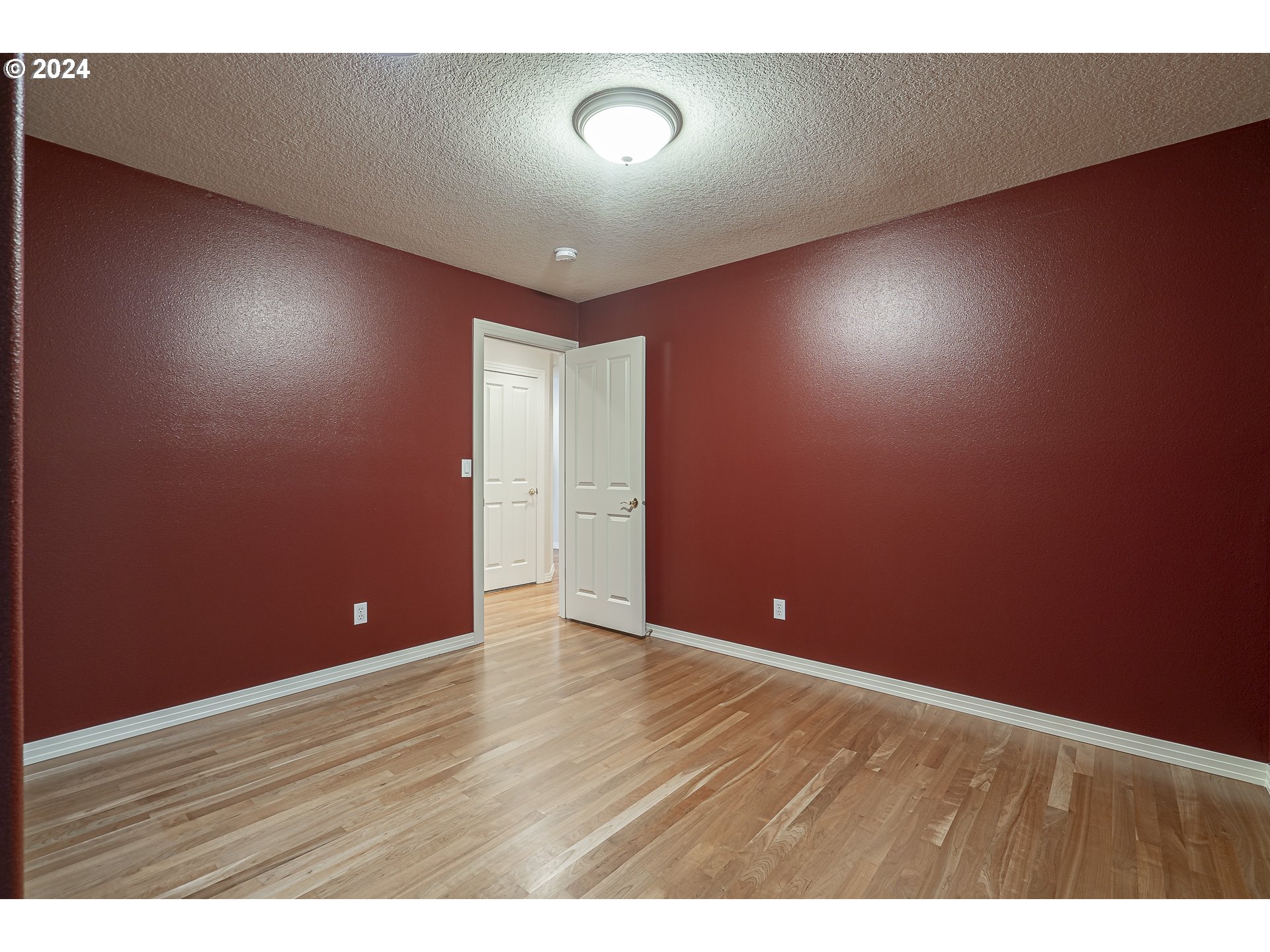 11084 Southeast Valley Way Happy Valley, OR 97086 - Photo 30 of 40 a view of an empty room with wooden floor