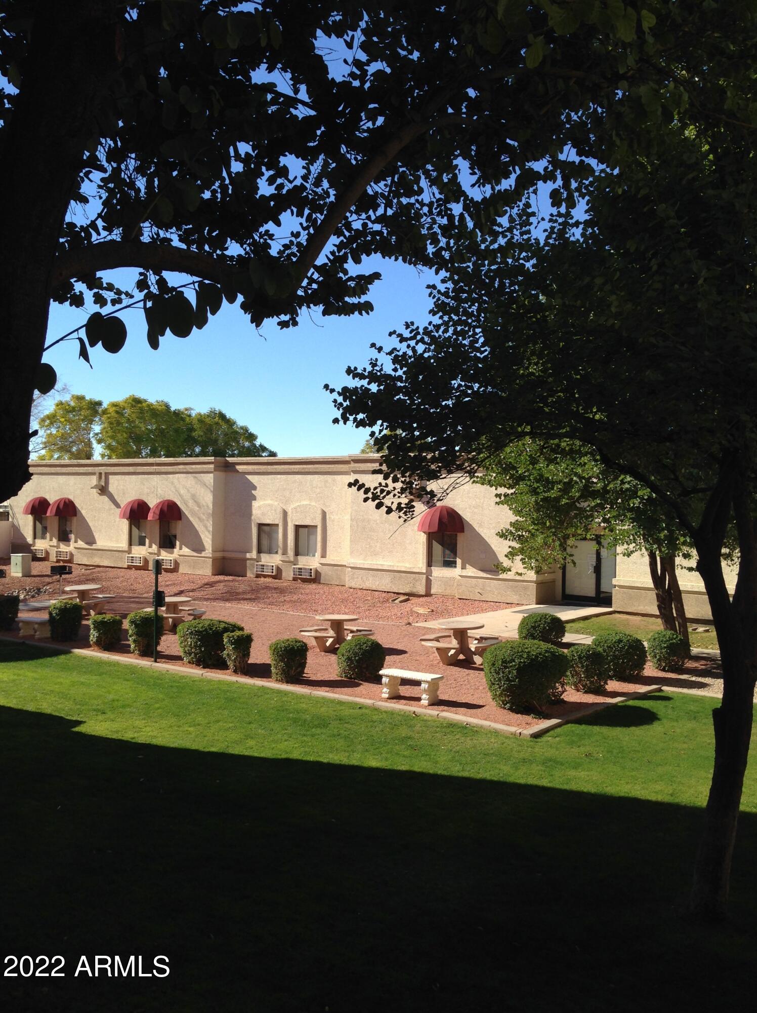 12221 West Bell Road, Unit 370 Surprise, AZ 85378 - Photo 15 of 18 a view of yard with outdoor seating and green space