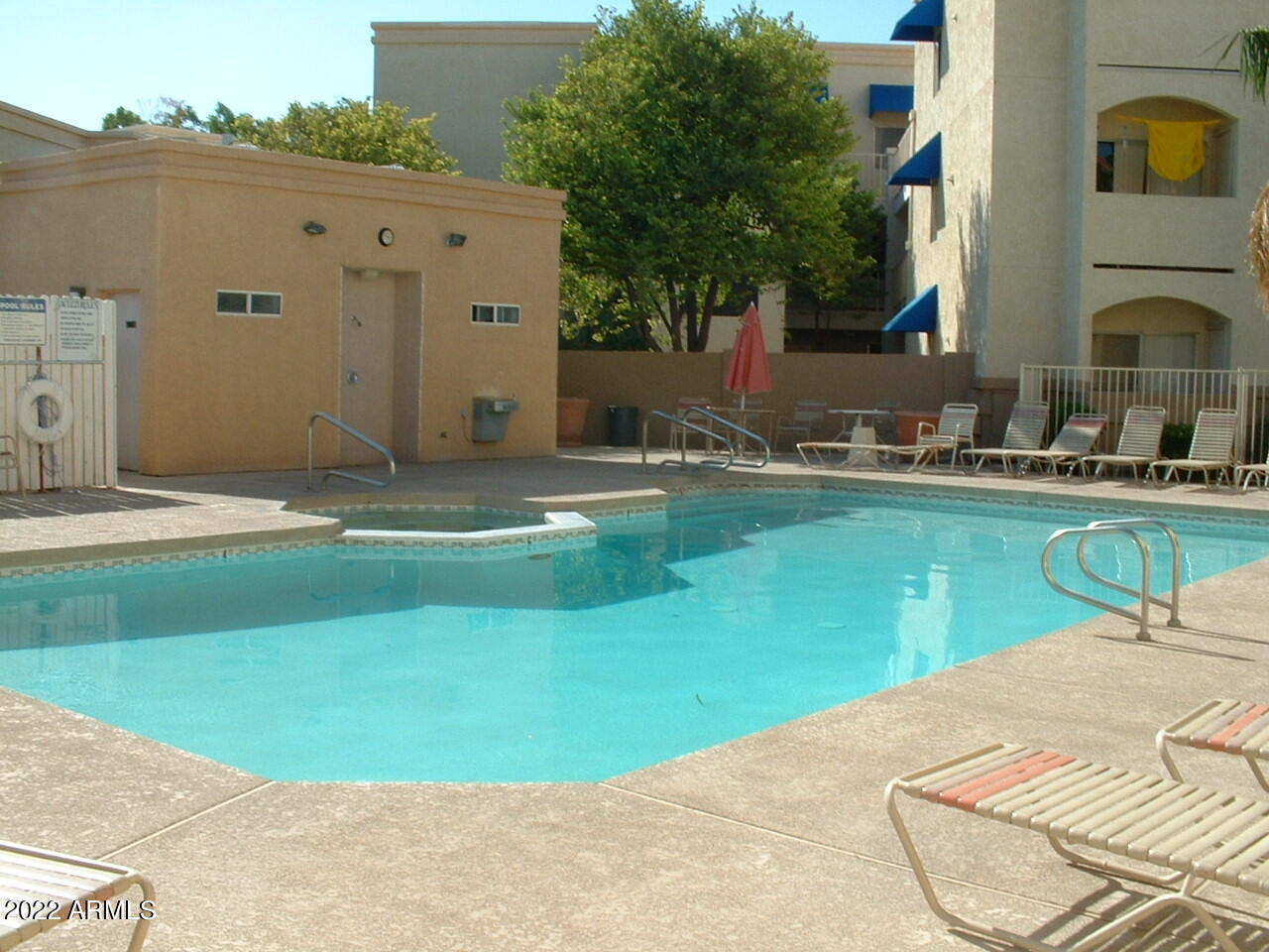 12221 West Bell Road, Unit 370 Surprise, AZ 85378 - Photo 17 of 18 a view of a house with a backyard