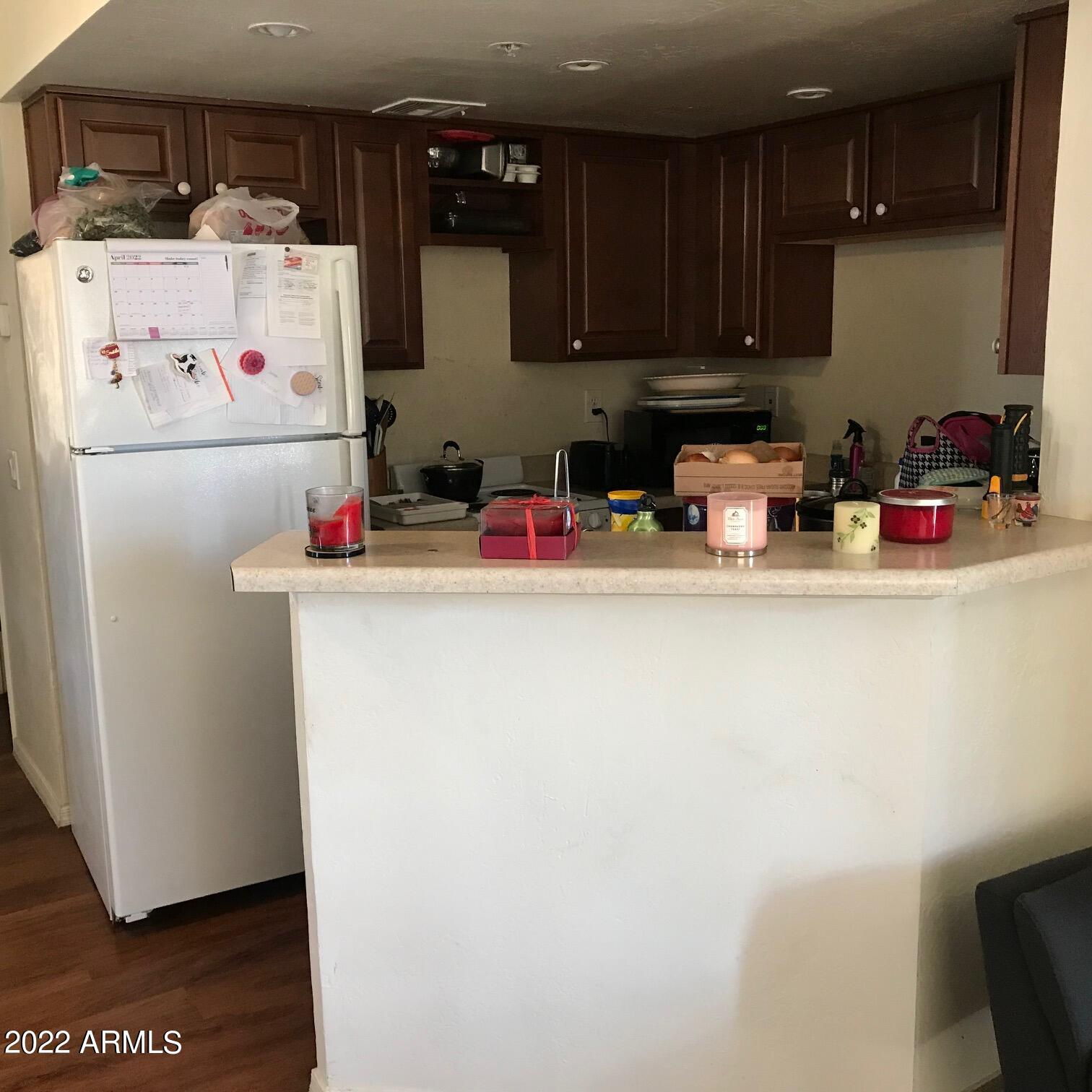 12221 West Bell Road, Unit 370 Surprise, AZ 85378 - Photo 5 of 18 KITCHEN WITH REFRIGERATOR & COUNTER