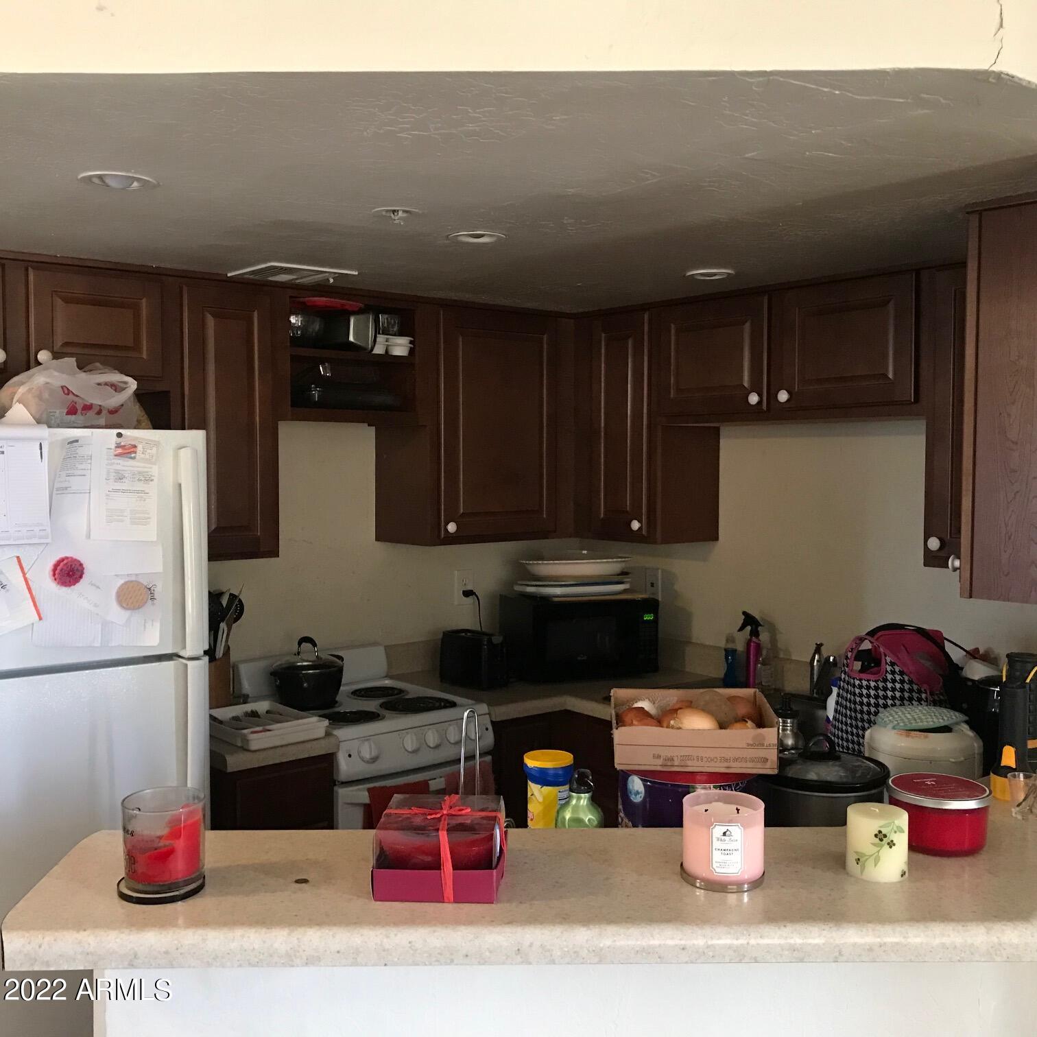 12221 West Bell Road, Unit 370 Surprise, AZ 85378 - Photo 7 of 18 KITCHEN WITH UPDATED CUPBOARDS